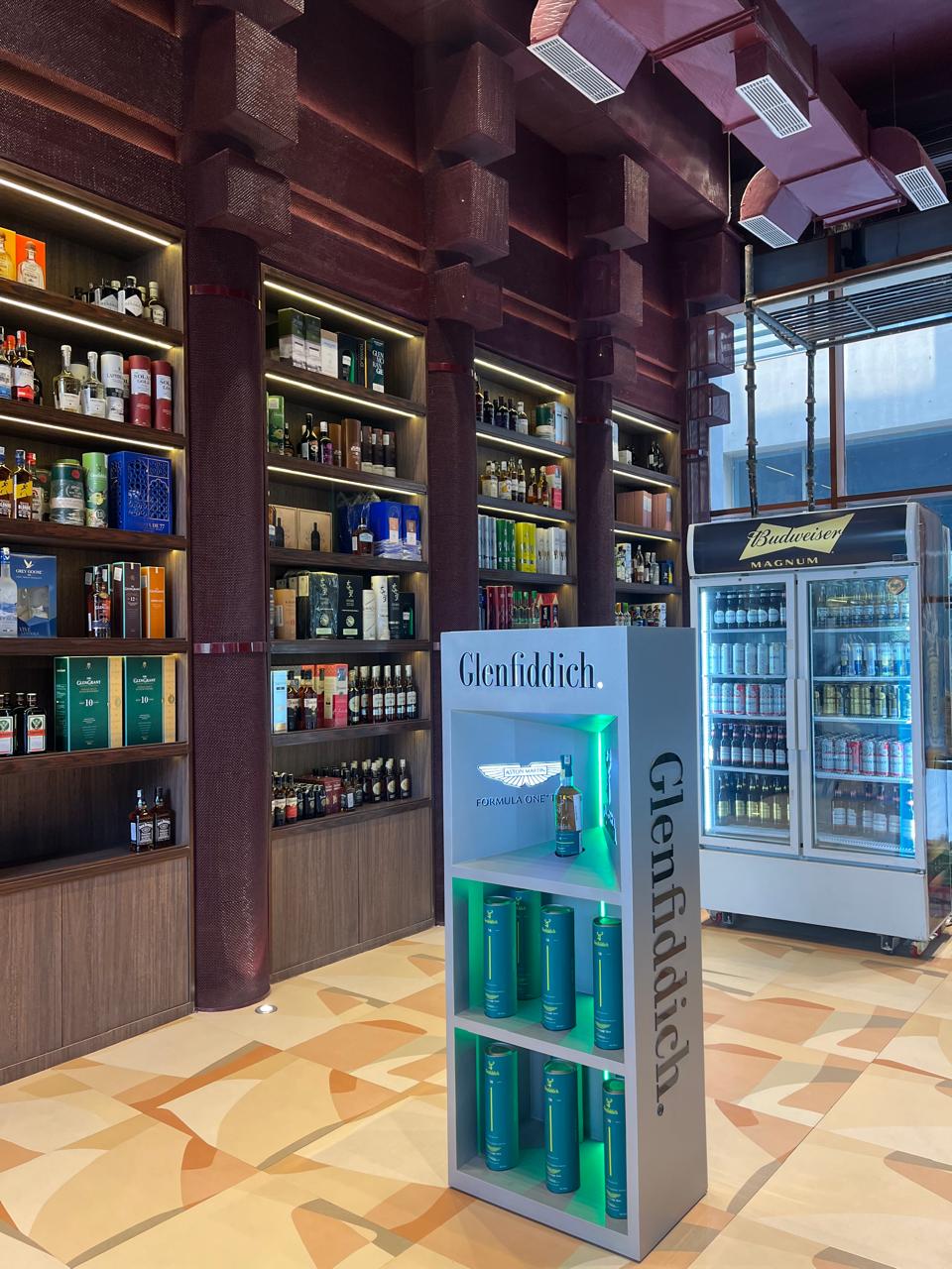 Luxury whisky and wine display inside premium liquor store Vandyk Spirits Noida