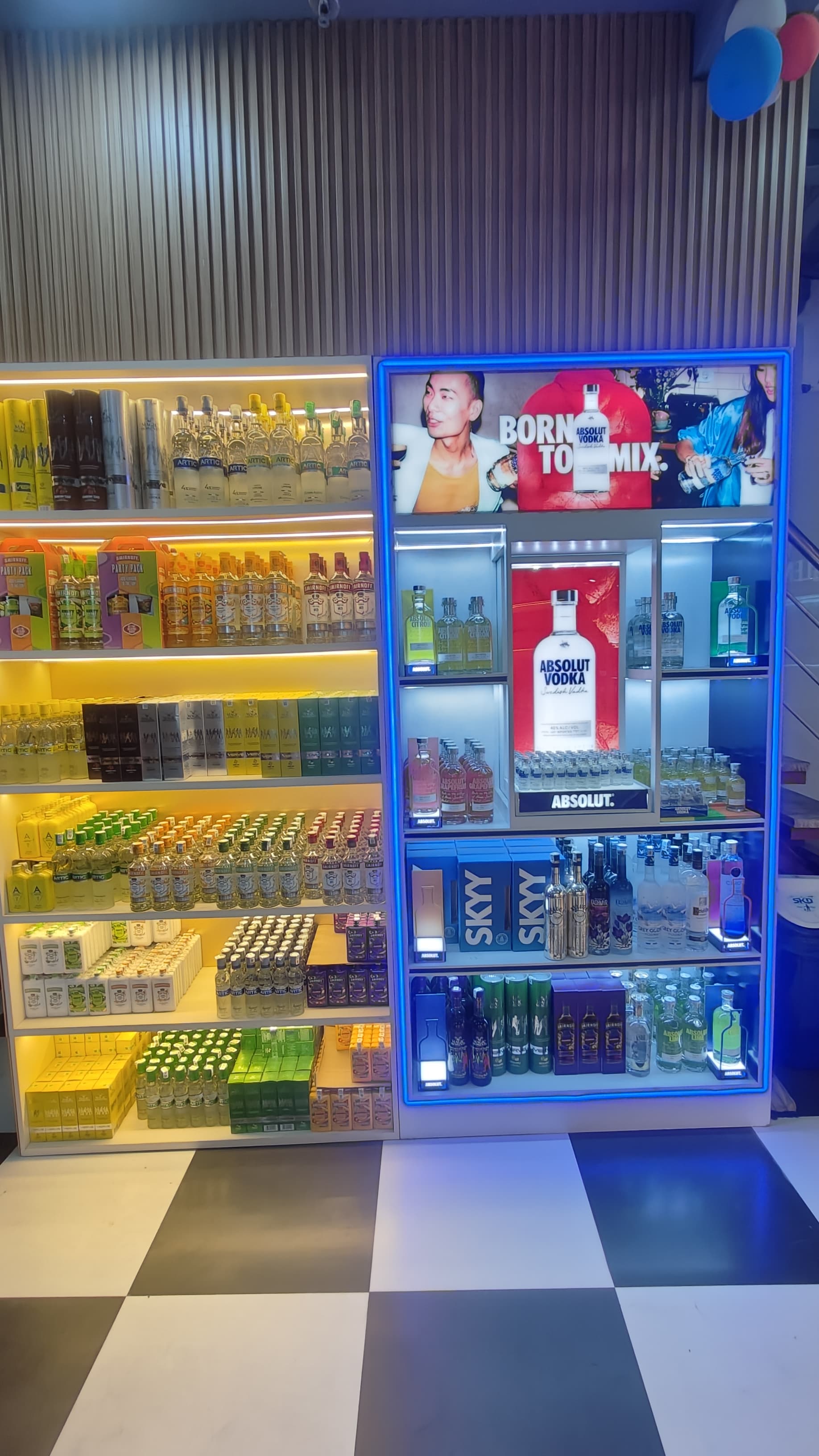 Wine and spirits shop showcasing a variety of premium liquor brands on shelves.