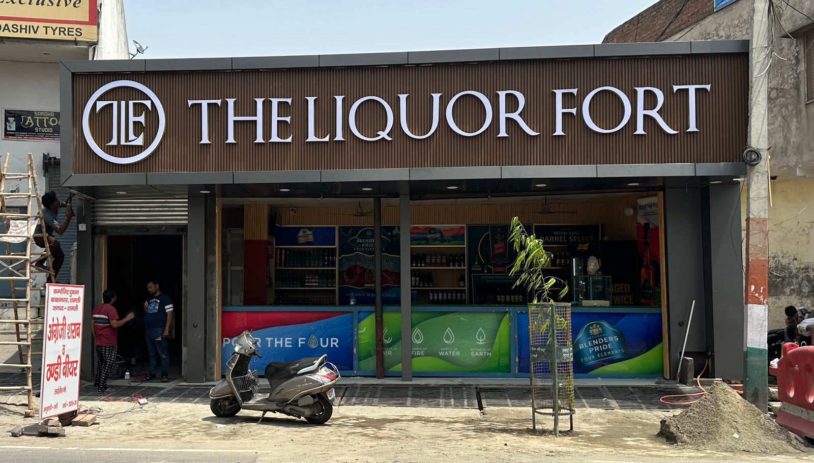 Beer and rum bottles displayed at local daaru store in Uttar Pradesh