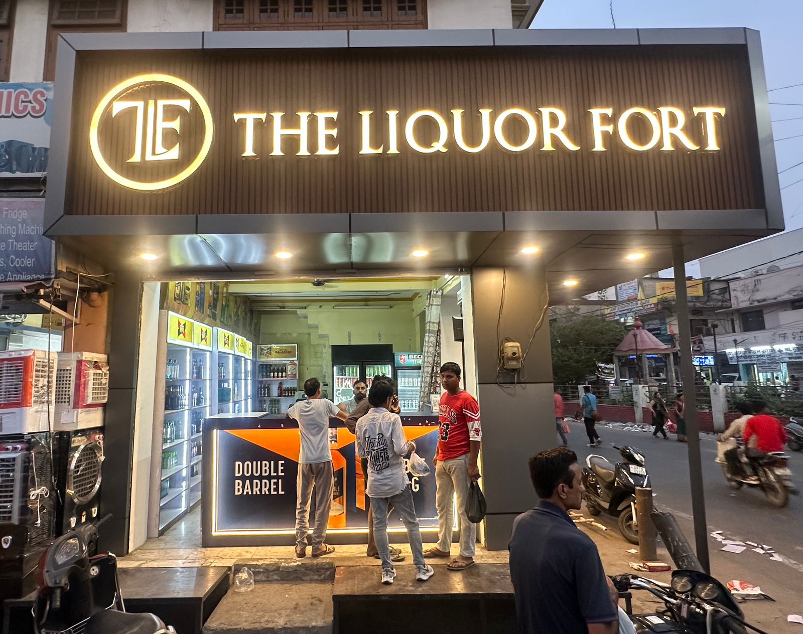 Liquor bottles arranged neatly behind counter in local UP shop
