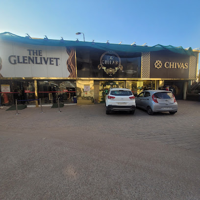 Premium liquor shelves with whisky, rum, vodka at The Cellar