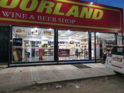 Premium liquor shelves with whisky, rum, vodka at Liquor Land
